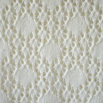 closeup for knitted lace pattern with rhombs