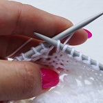 fixing mistakes in lace knitting - yarn over step 1