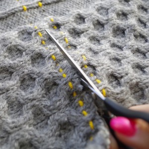 cutting knitted garment