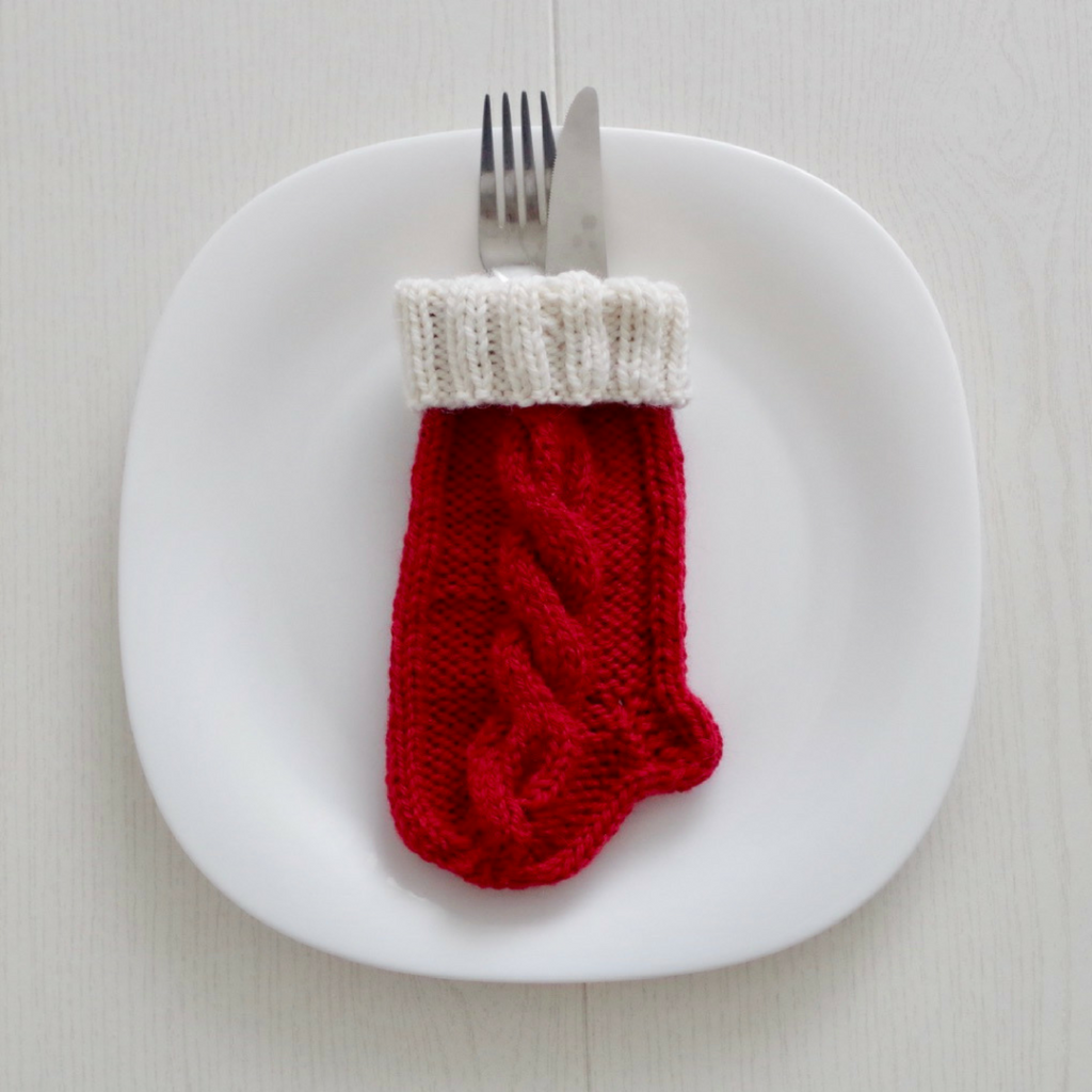 Knitting pattern for a tiny Christmas stocking for table setting